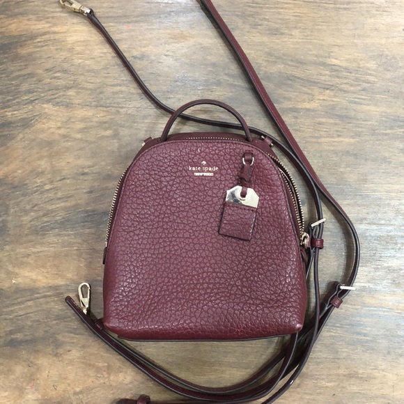 Kate spade burgundy mini backpack.